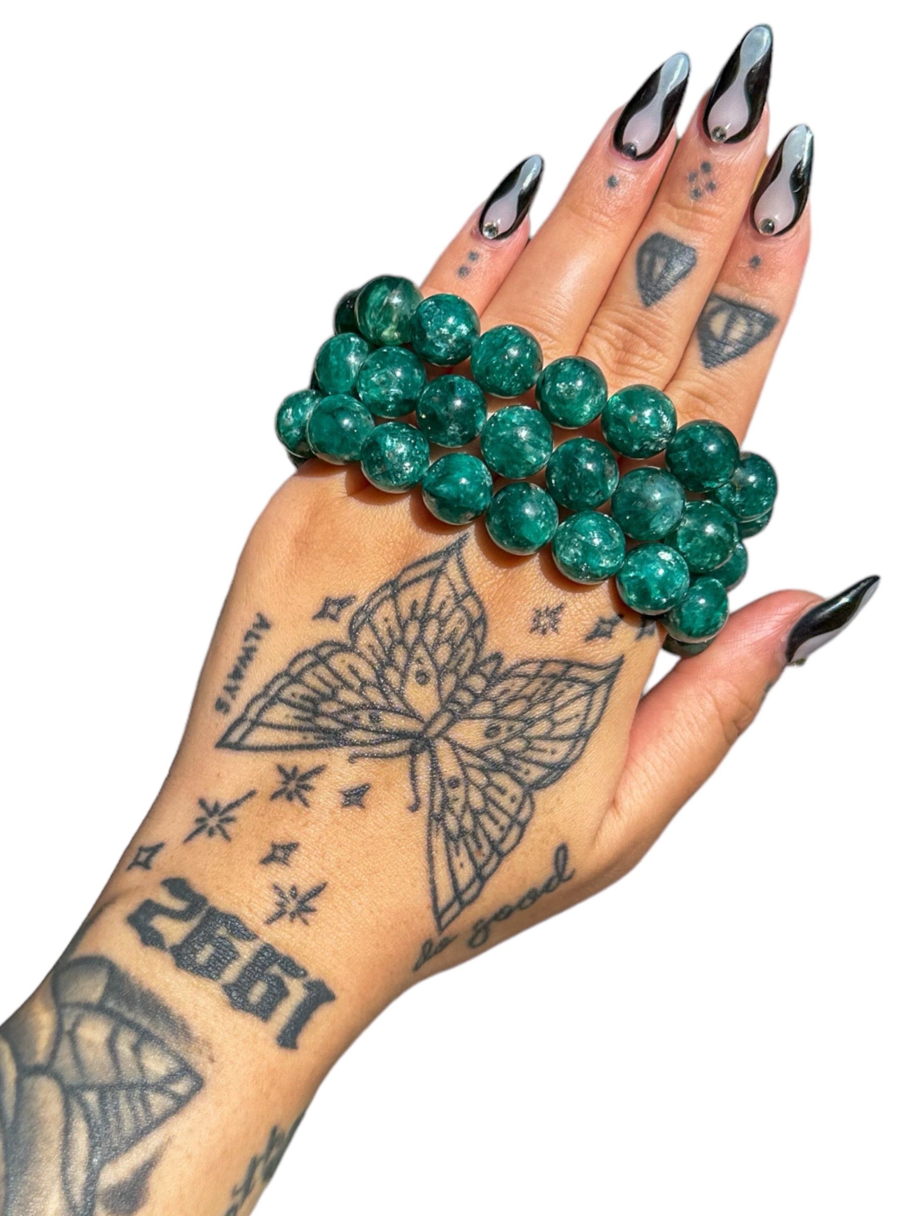 Emerald Tattoo Ideas | TattoosAI
